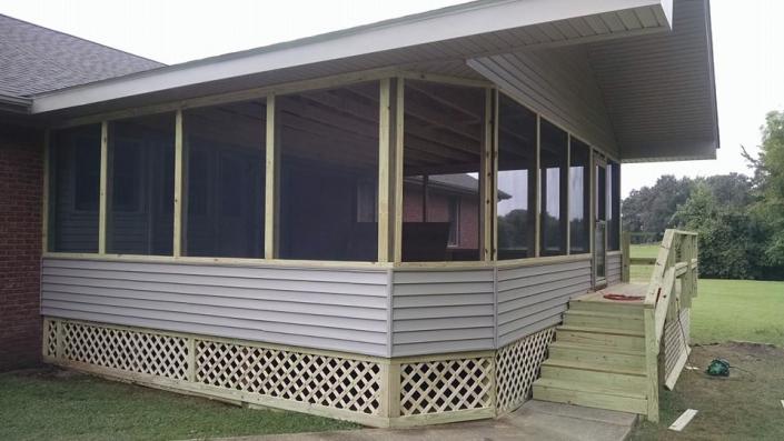 We built this new closed-in patio including installing the siding, roof and steps!