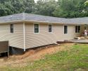 Boyd Roofing and Construction built the new porch and addition to the house with new vinyl, windows and roof!